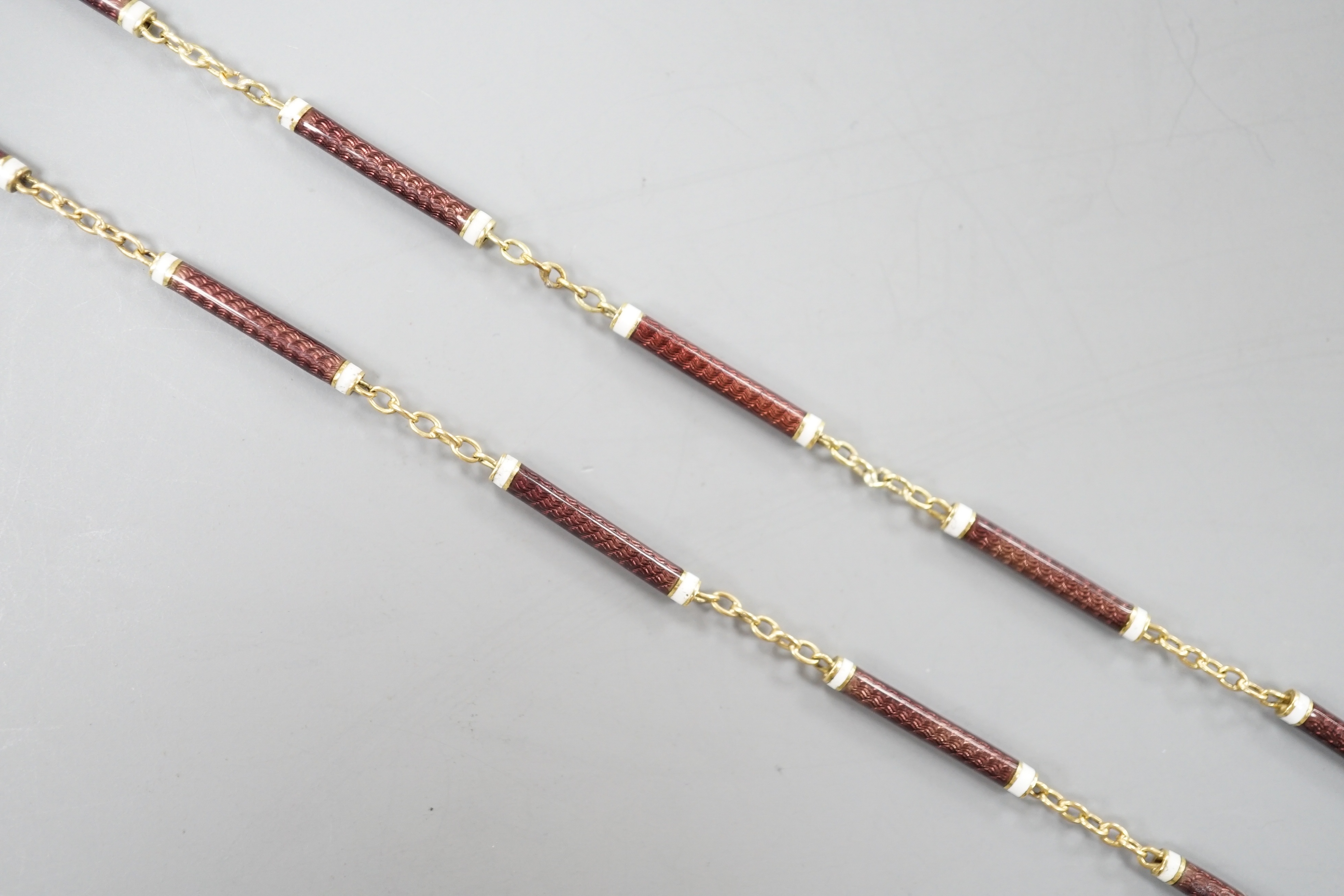 A 9ct and two colour enamelled baton link necklace, 52cm, gross 7.1 grams.